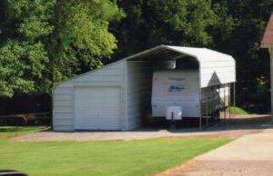 24 x 30 slant roof RV cover and enclosed side stall with 9 x 7 garage door.