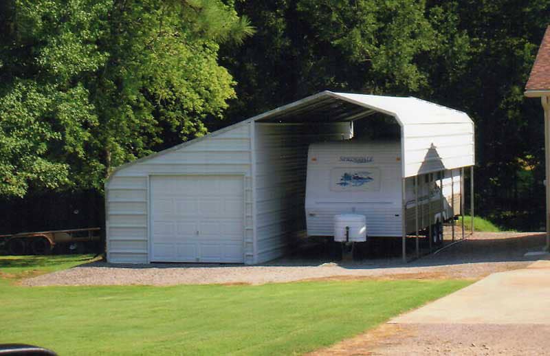 24 x 30 slant roof RV cover and enclosed side stall with 9 x 7 garage door.