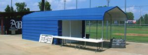 Combination pavilion and storage structure adjacent to baseball field.